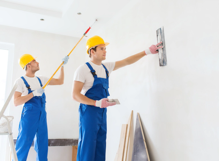 workers painting walls