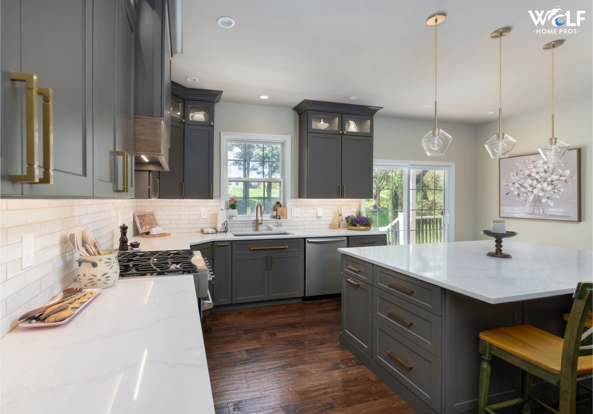 Full kitchen remodel in Avondale, PA with custom cabinetry, quartz countertops, island, backsplash, and hardwood flooring.