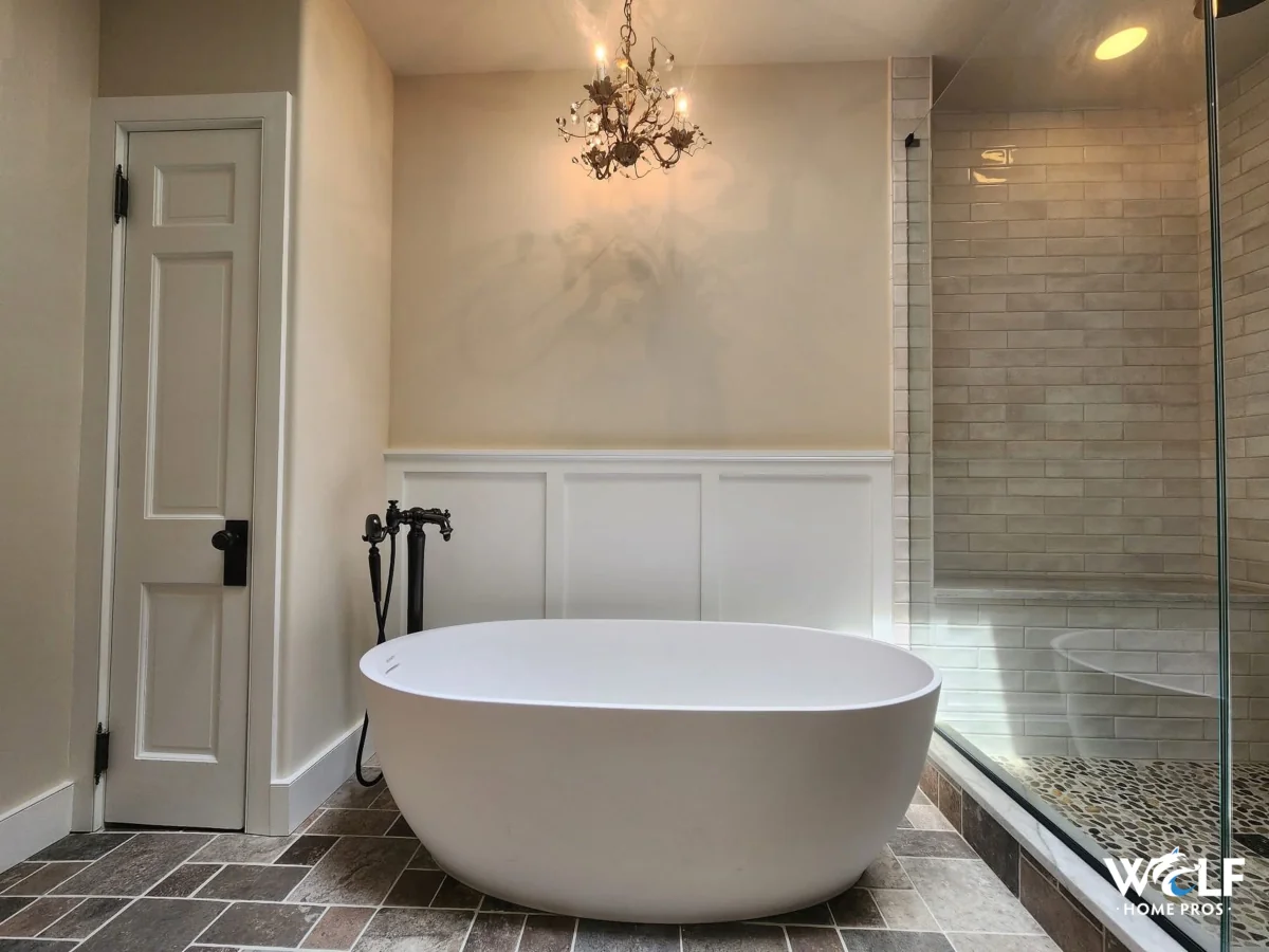 Freestanding tub and tiled walk-in shower in a remodeled bathroom in Berwyn, PA.