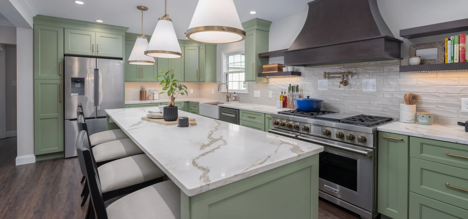 Green Onyx kitchen remodel in Coatesville, PA with large island, custom range hood and updated first-floor finishes.