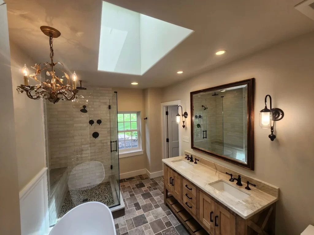 Bathroom remodel in Berwyn, PA with a soaking tub, walk-in shower, and double vanity by Wolf Home Pros