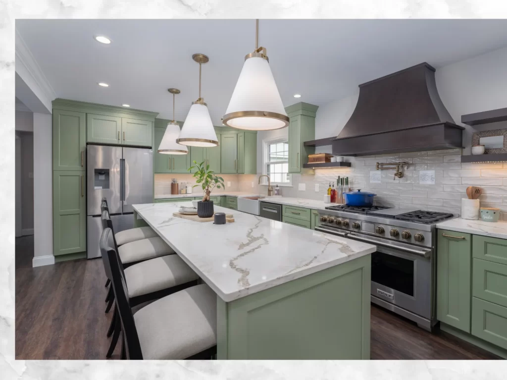 Completed Coatesville, PA kitchen remodel with Green Onyx cabinetry, large quartz island, custom range hood and pendant lighting.
