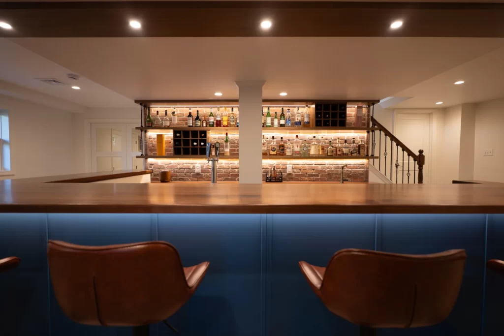 Custom wet bar in a finished basement remodel in West Chester, PA by Wolf Home Pros