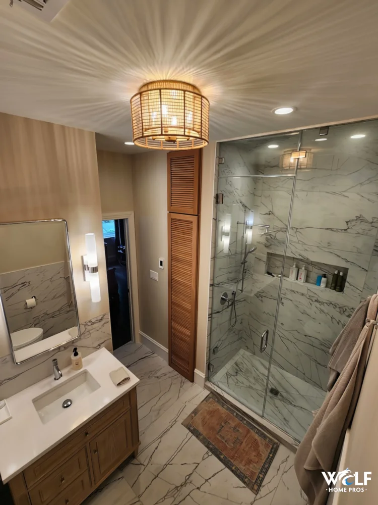 Fully remodeled bathroom with new tile shower, flooring, fixtures and lighting in Villanova, PA