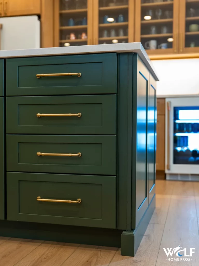 Kitchen island storage in Chester Springs, PA with custom drawers and a beverage refrigerator by Wolf Home Pros.