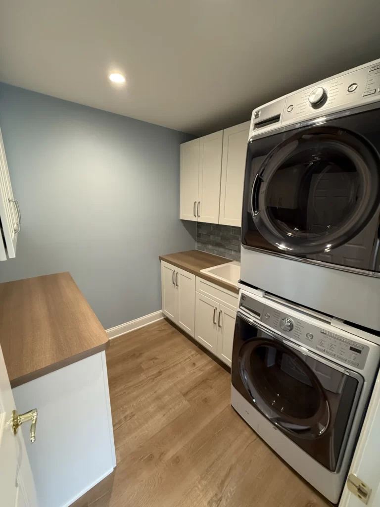 Custom laundry room built-ins and sink installed by Wolf Home Pros during a Downingtown, PA first-floor remodel.